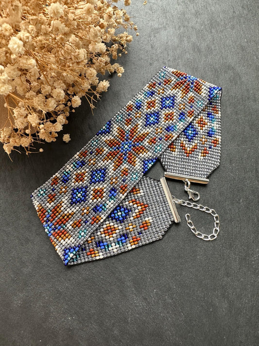 Unique handmade beaded choker with brown star ornament and blue accents on transparent base. Unique boho statement choker necklace for standout style image 2