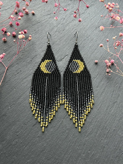 Handmade long black beaded earrings with golden lunar eclipse design and boho fringe. Unique statement jewelry image 1