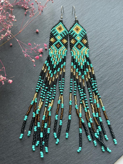 Handmade long black, turquoise, and gold beaded earrings with Native American ethnic design and fringe. Unique boho statement earrings for women image 8