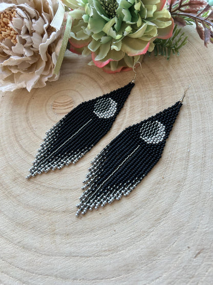 Unique handmade black beaded earrings with silver lunar eclipse motif and fringe. Boho celestial statement jewelry for mystical and artistic style image 3