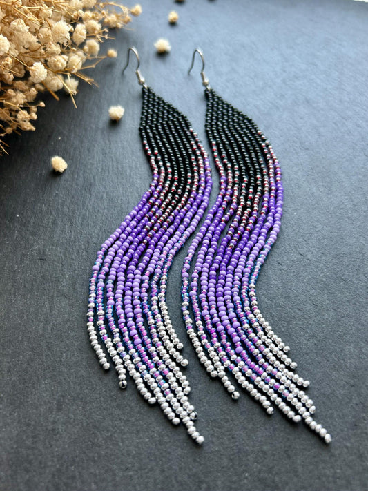 Long black beaded earrings in purple ombré style with fringe and silver tips. Handmade boho jewelry that is unique, vibrant, and adds elegance and movement  image 1