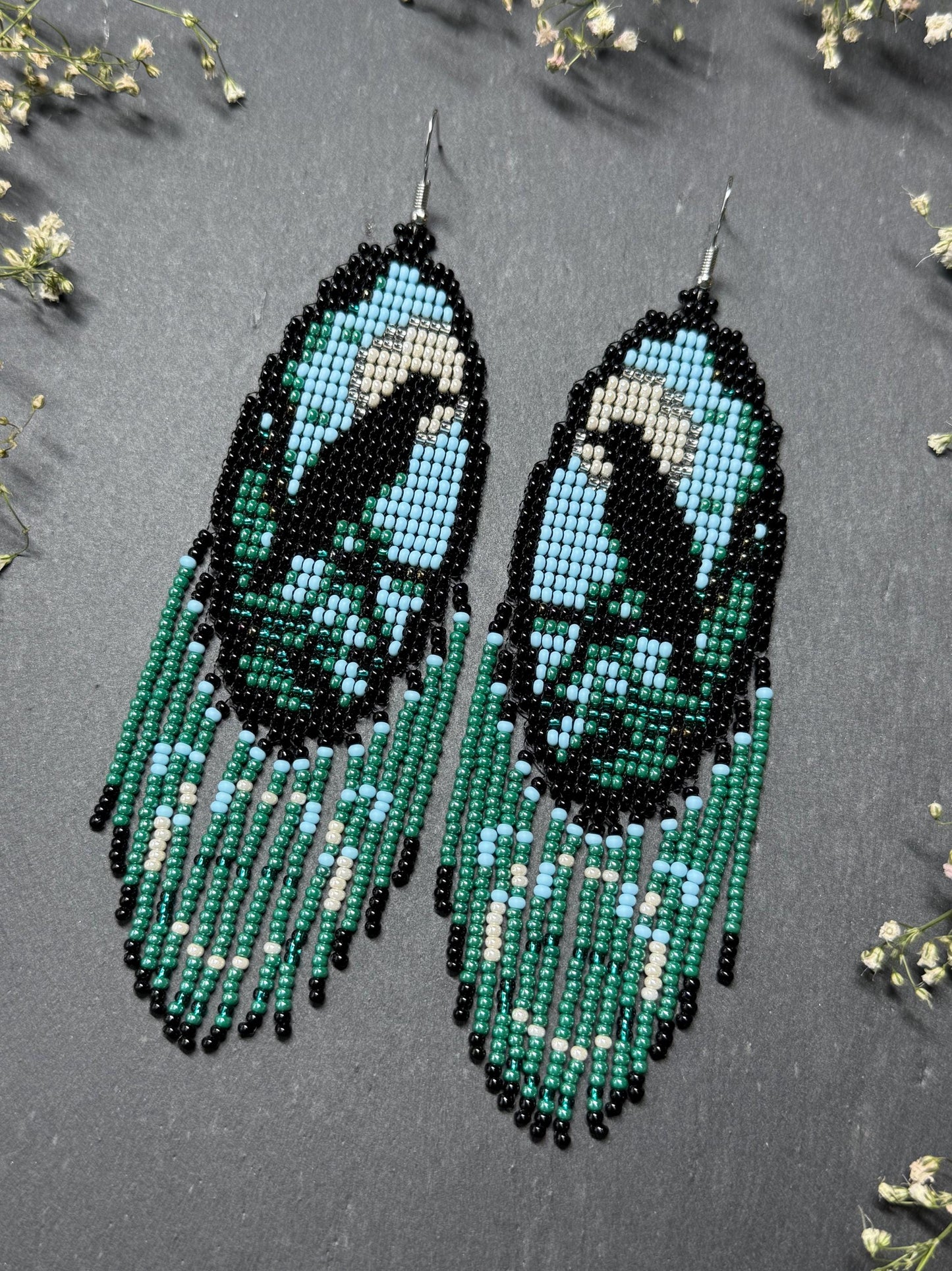 Long handmade beaded earrings in black, green, blue and beige featuring a raven and moon design with fringe. Boho statement jewelry, unique gift for her image 3