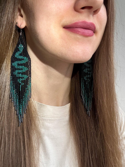 Handmade long beaded earrings with green snake design in boho style. Unique statement jewelry with fringe, perfect gift and standout accessory for any look image 2