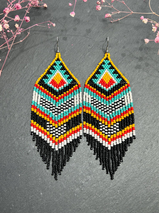 Bright handmade beaded fringe earrings in black, white, turquoise, red and orange with Native American motif. Statement boho earrings for women, perfect gift image 1