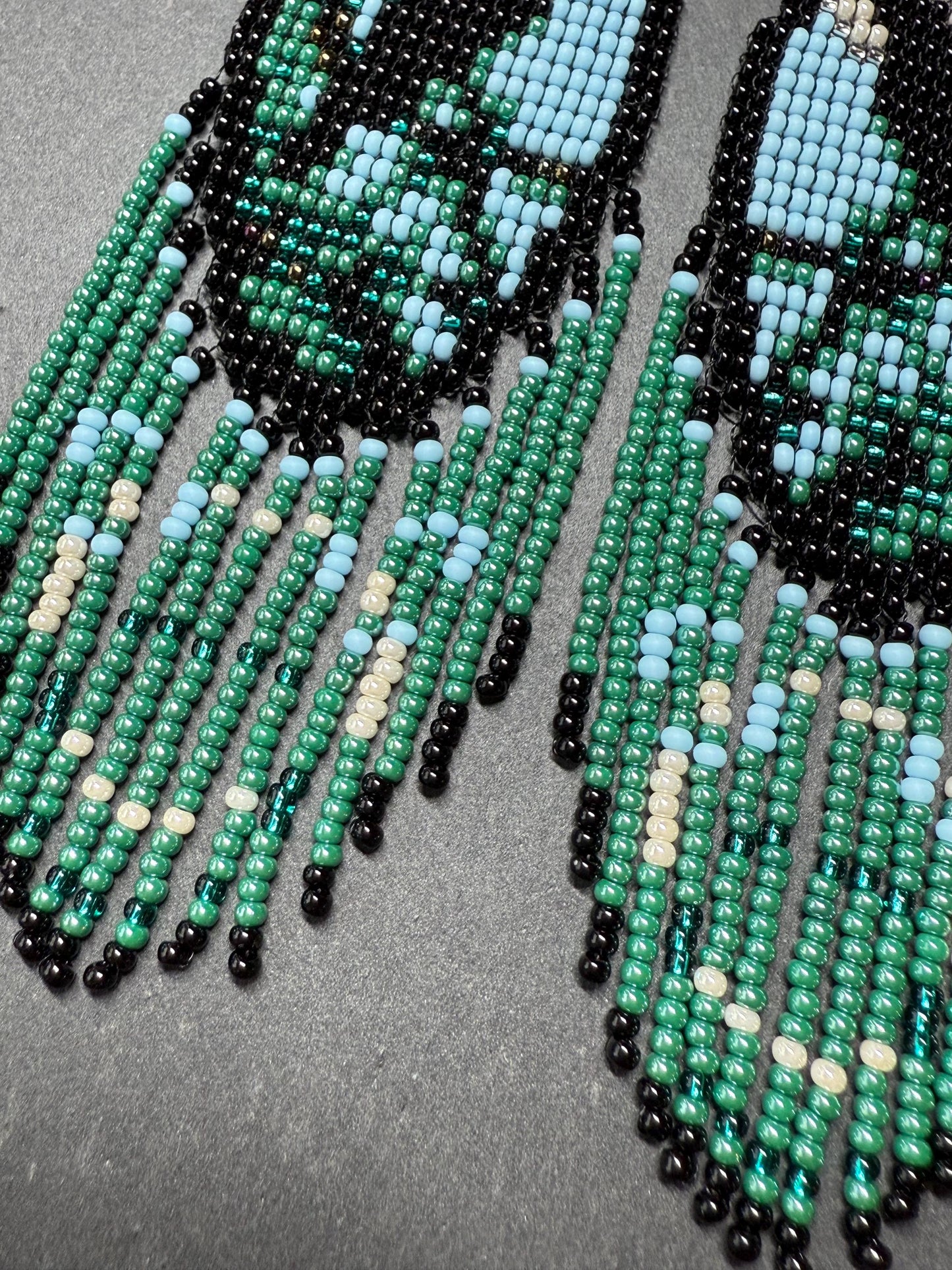 Long handmade beaded earrings in black, green, blue and beige featuring a raven and moon design with fringe. Boho statement jewelry, unique gift for her image 5