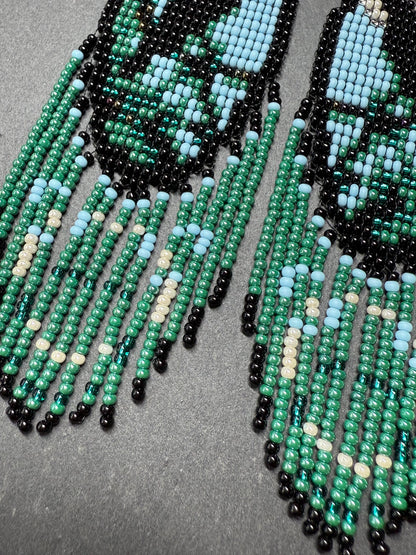 Long handmade beaded earrings in black, green, blue and beige featuring a raven and moon design with fringe. Boho statement jewelry, unique gift for her image 5