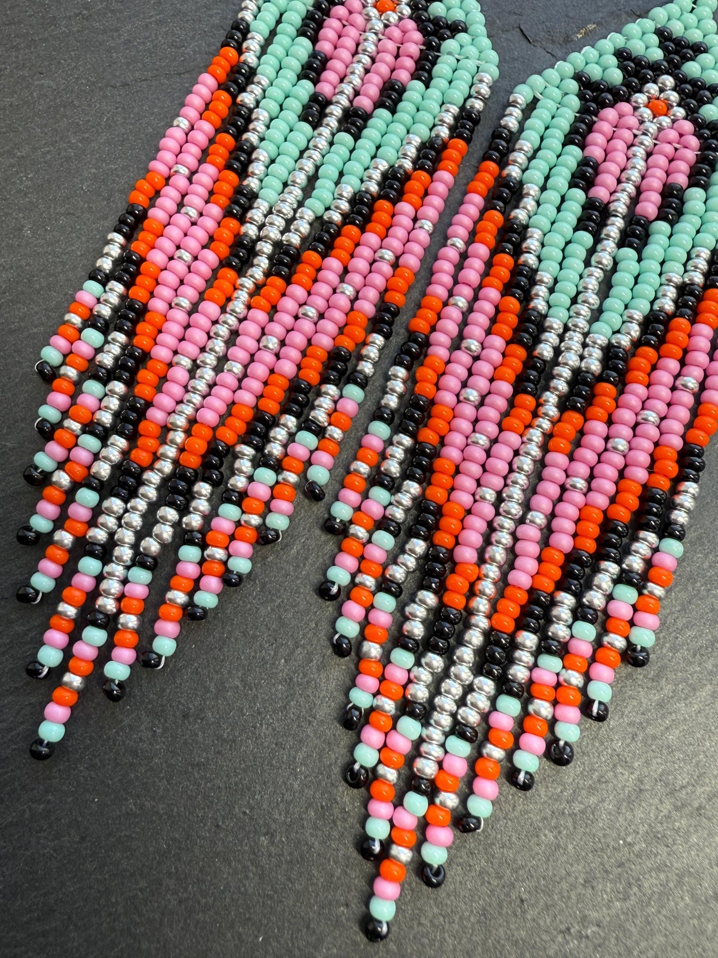 Handmade long beaded boho earrings in turquoise, black, silver, pink, and orange. Geometric design with elegant fringe, lightweight statement jewelry for any occasion  image 4