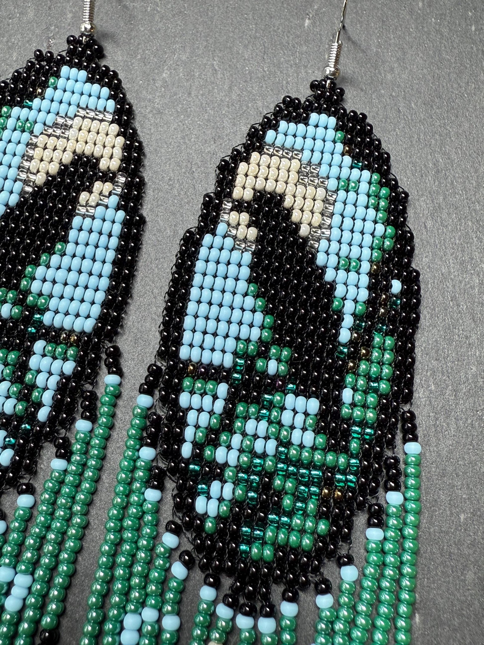 Long handmade beaded earrings in black, green, blue and beige featuring a raven and moon design with fringe. Boho statement jewelry, unique gift for her image 7