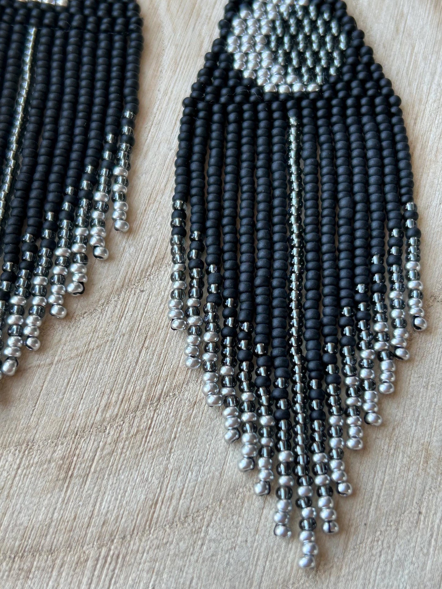 Unique handmade black beaded earrings with silver lunar eclipse motif and fringe. Boho celestial statement jewelry for mystical and artistic style image 5