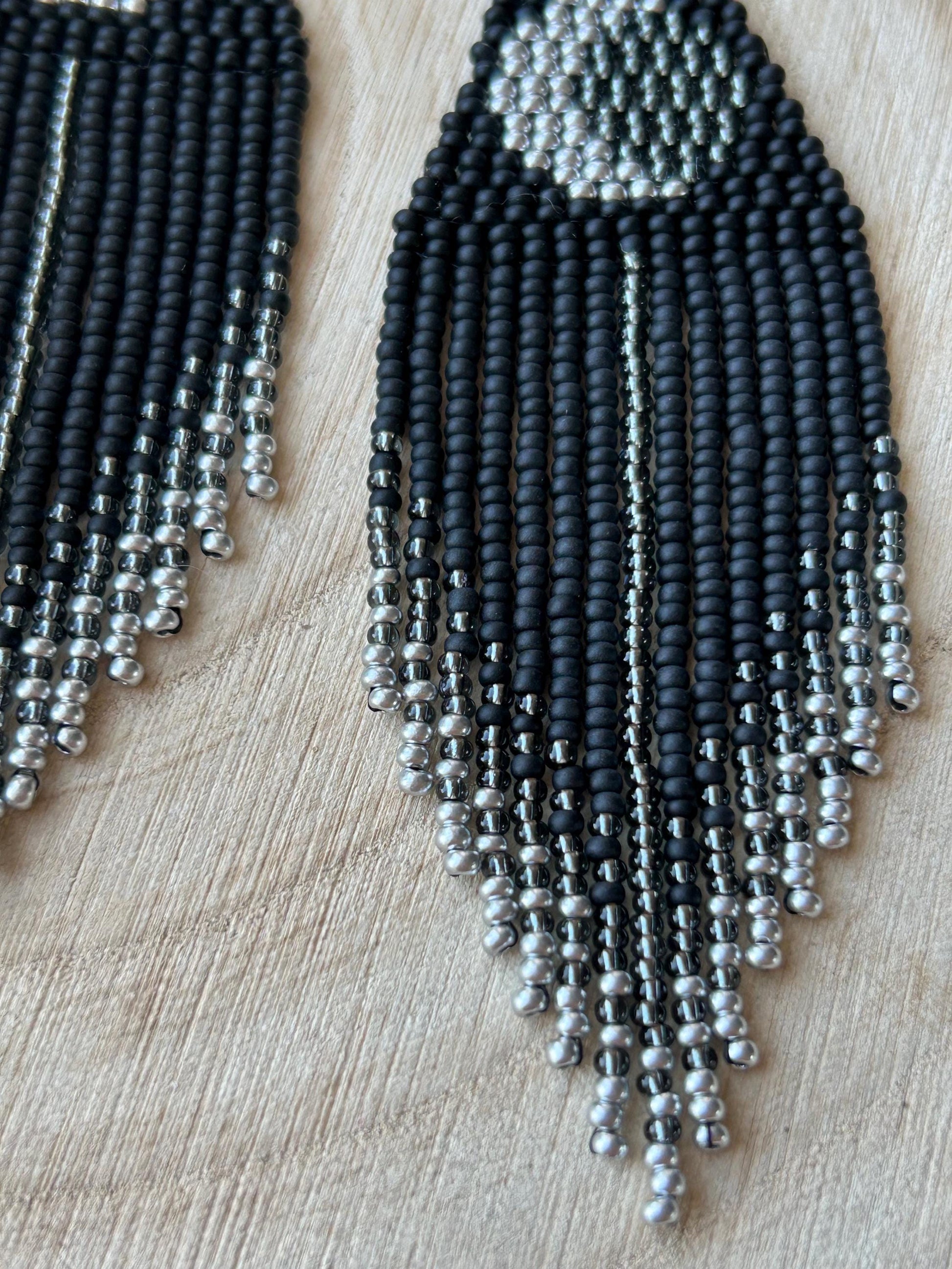 Unique handmade black beaded earrings with silver lunar eclipse motif and fringe. Boho celestial statement jewelry for mystical and artistic style image 5