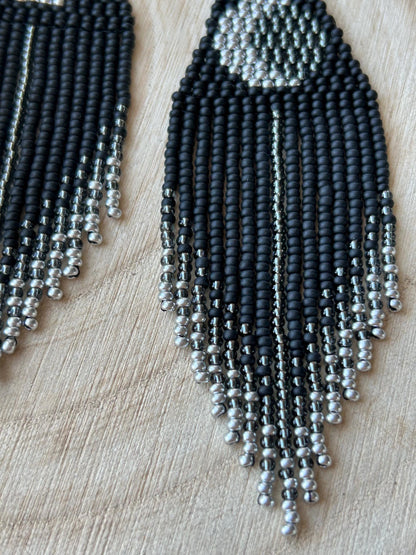 Unique handmade black beaded earrings with silver lunar eclipse motif and fringe. Boho celestial statement jewelry for mystical and artistic style image 5