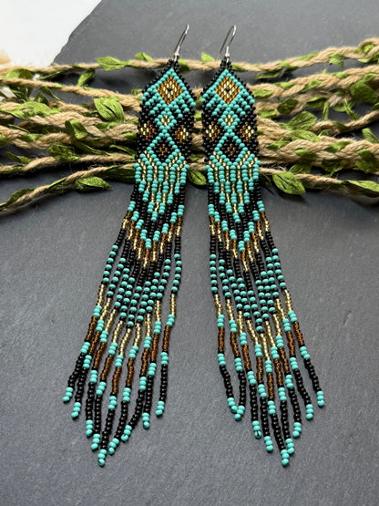 Handmade long black, turquoise, and gold beaded earrings with Native American ethnic design and fringe. Unique boho statement earrings for women image 17