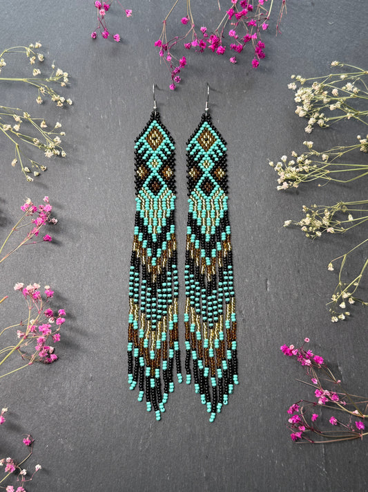 Handmade long black, turquoise, and gold beaded earrings with Native American ethnic design and fringe. Unique boho statement earrings for women image 1