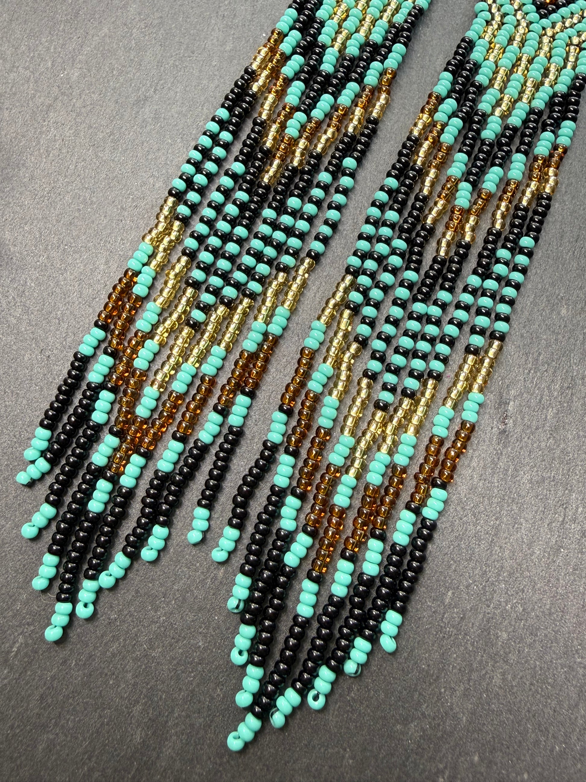 Handmade long black, turquoise, and gold beaded earrings with Native American ethnic design and fringe. Unique boho statement earrings for women image 7