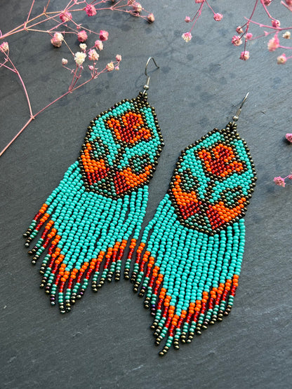 Unique handmade long beaded earrings in turquoise, orange, and red with floral design and fringe. Boho statement jewelry, cute multicolor earrings for women image 3