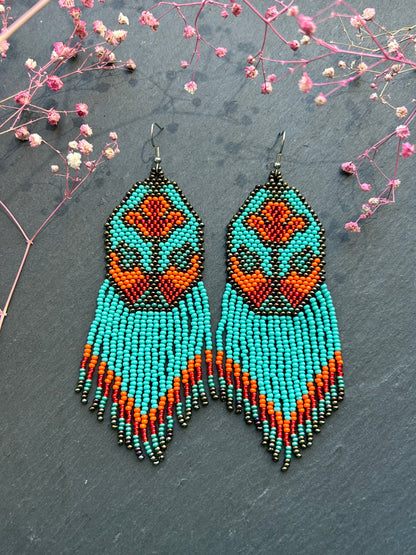 Unique handmade long beaded earrings in turquoise, orange, and red with floral design and fringe. Boho statement jewelry, cute multicolor earrings for women image 1