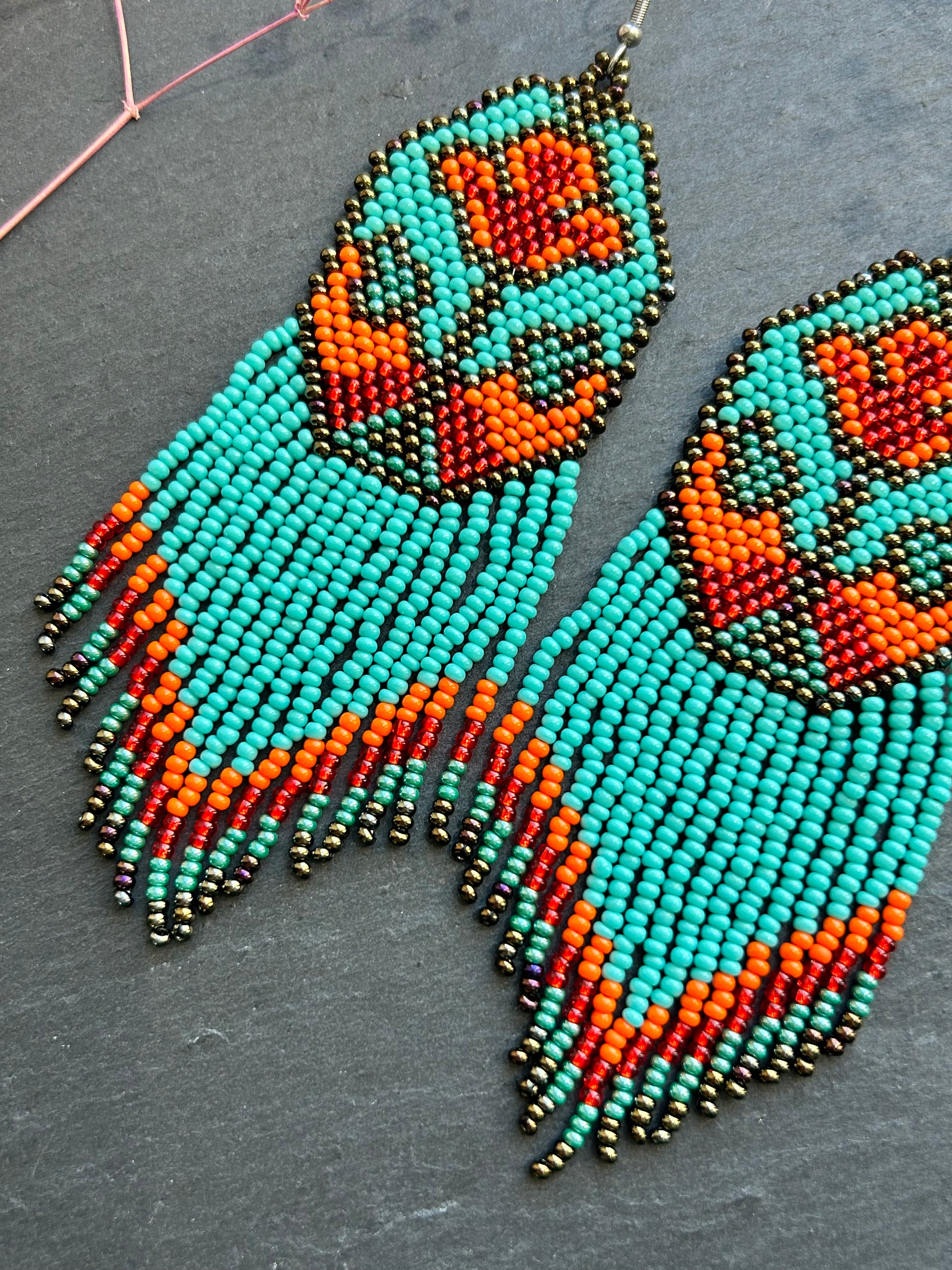 Unique handmade long beaded earrings in turquoise, orange, and red with floral design and fringe. Boho statement jewelry, cute multicolor earrings for women image 5