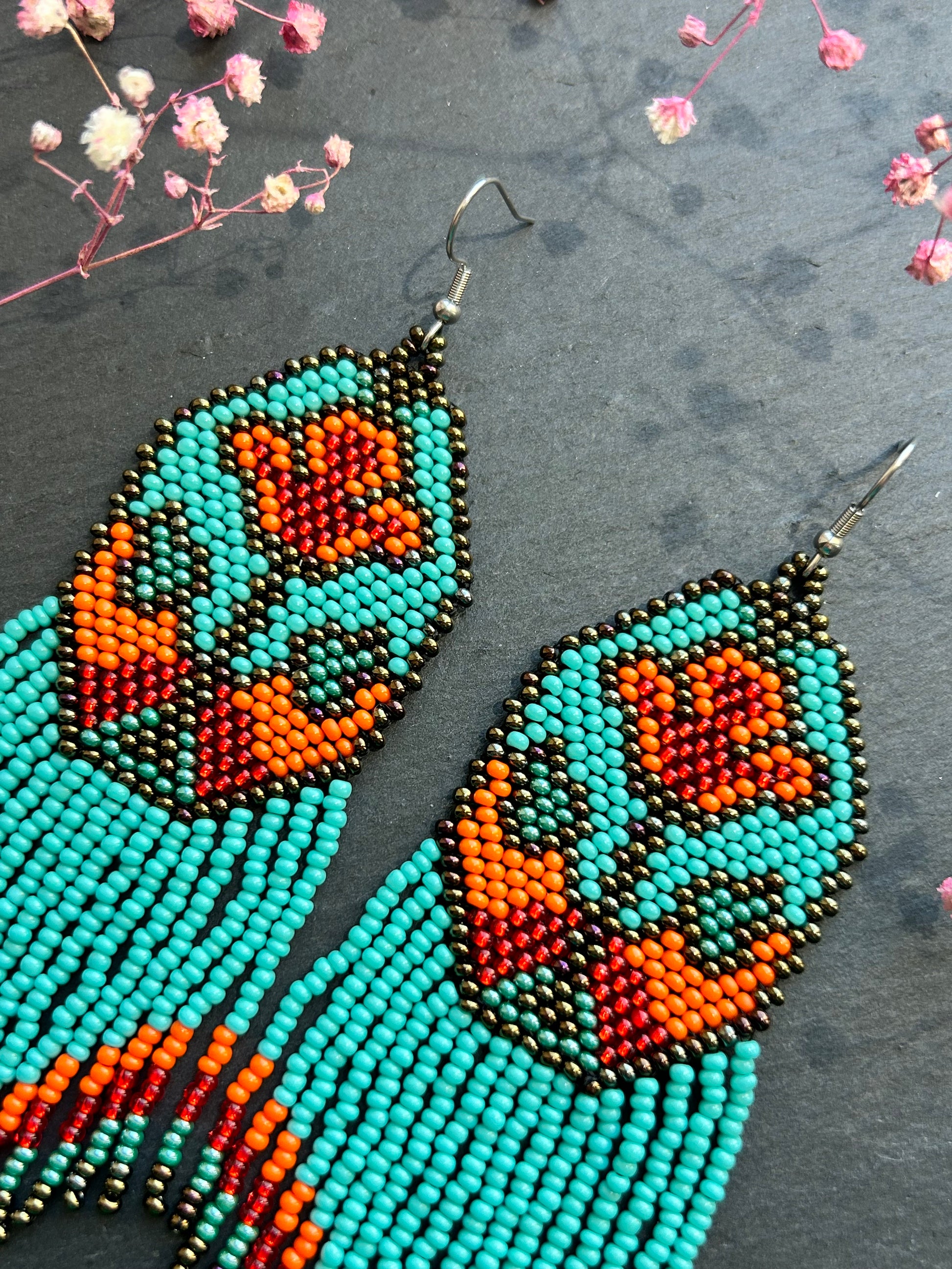 Unique handmade long beaded earrings in turquoise, orange, and red with floral design and fringe. Boho statement jewelry, cute multicolor earrings for women image 4