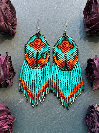 Unique handmade long beaded earrings in turquoise, orange, and red with floral design and fringe. Boho statement jewelry, cute multicolor earrings for women image 11