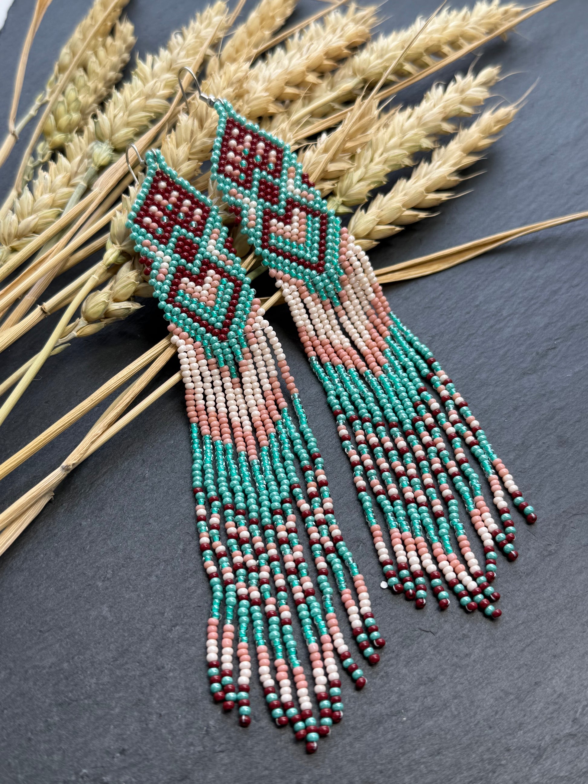 Unique handmade beaded dangle earrings with Native American motif in turquoise, beige and burgundy. Bright boho statement earrings for women, perfect gift image 1