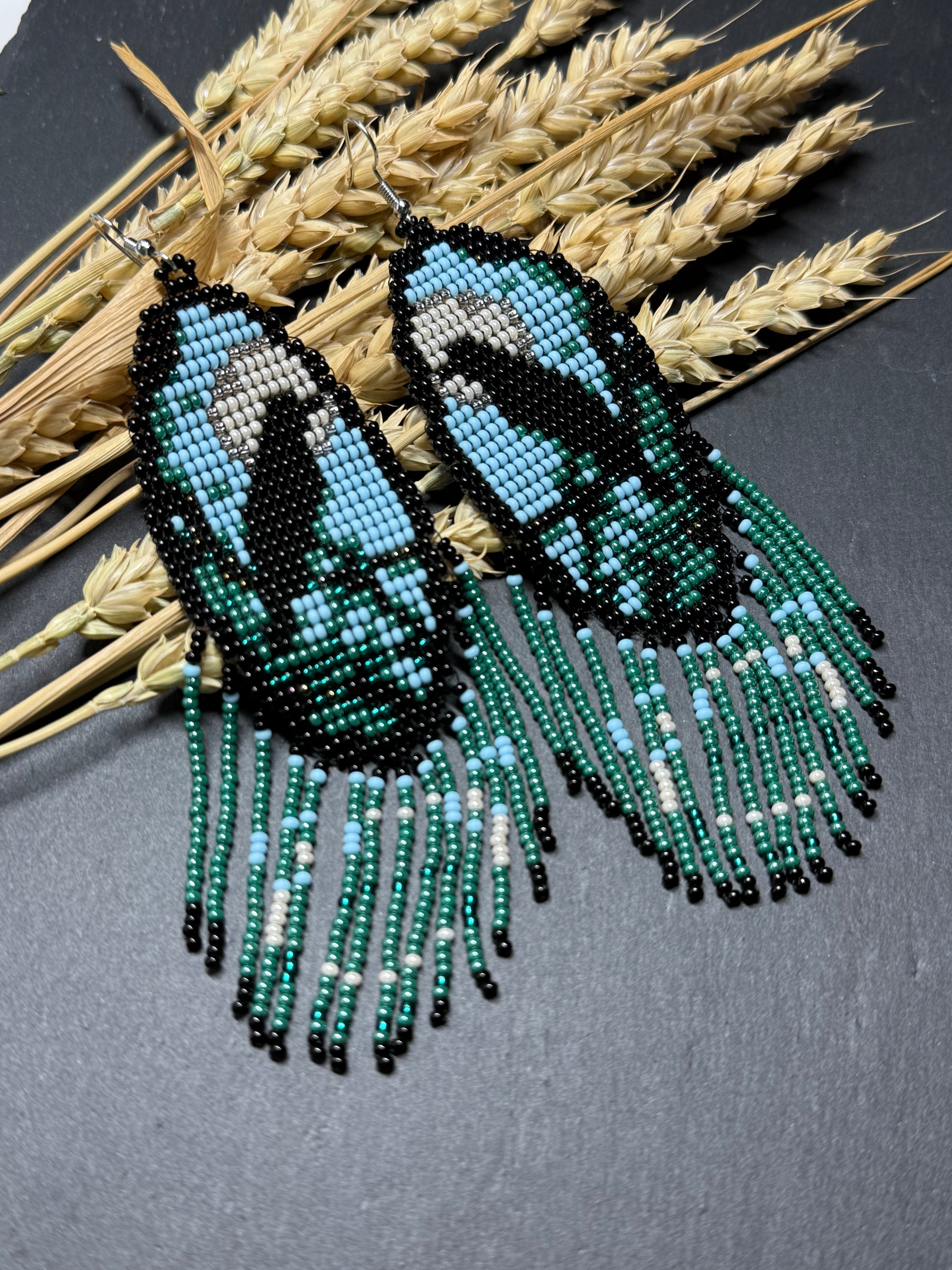 Long handmade beaded earrings in black, green, blue and beige featuring a raven and moon design with fringe. Boho statement jewelry, unique gift for her image 14
