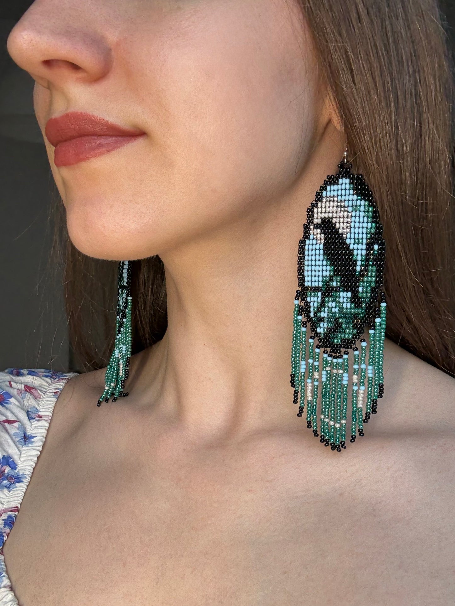 Long handmade beaded earrings in black, green, blue and beige featuring a raven and moon design with fringe. Boho statement jewelry, unique gift for her image 2