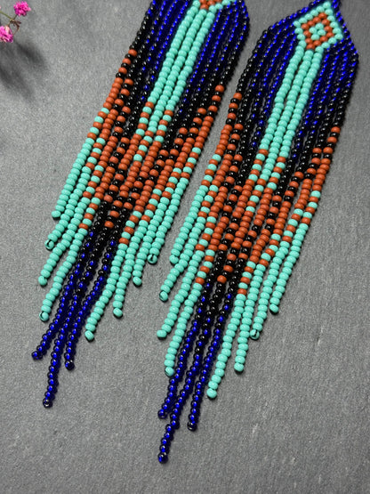 Bright blue, black, brown, and turquoise handmade beaded fringe earrings for women. Unique boho jewelry and statement beadwork, perfect native gift for women image 4
