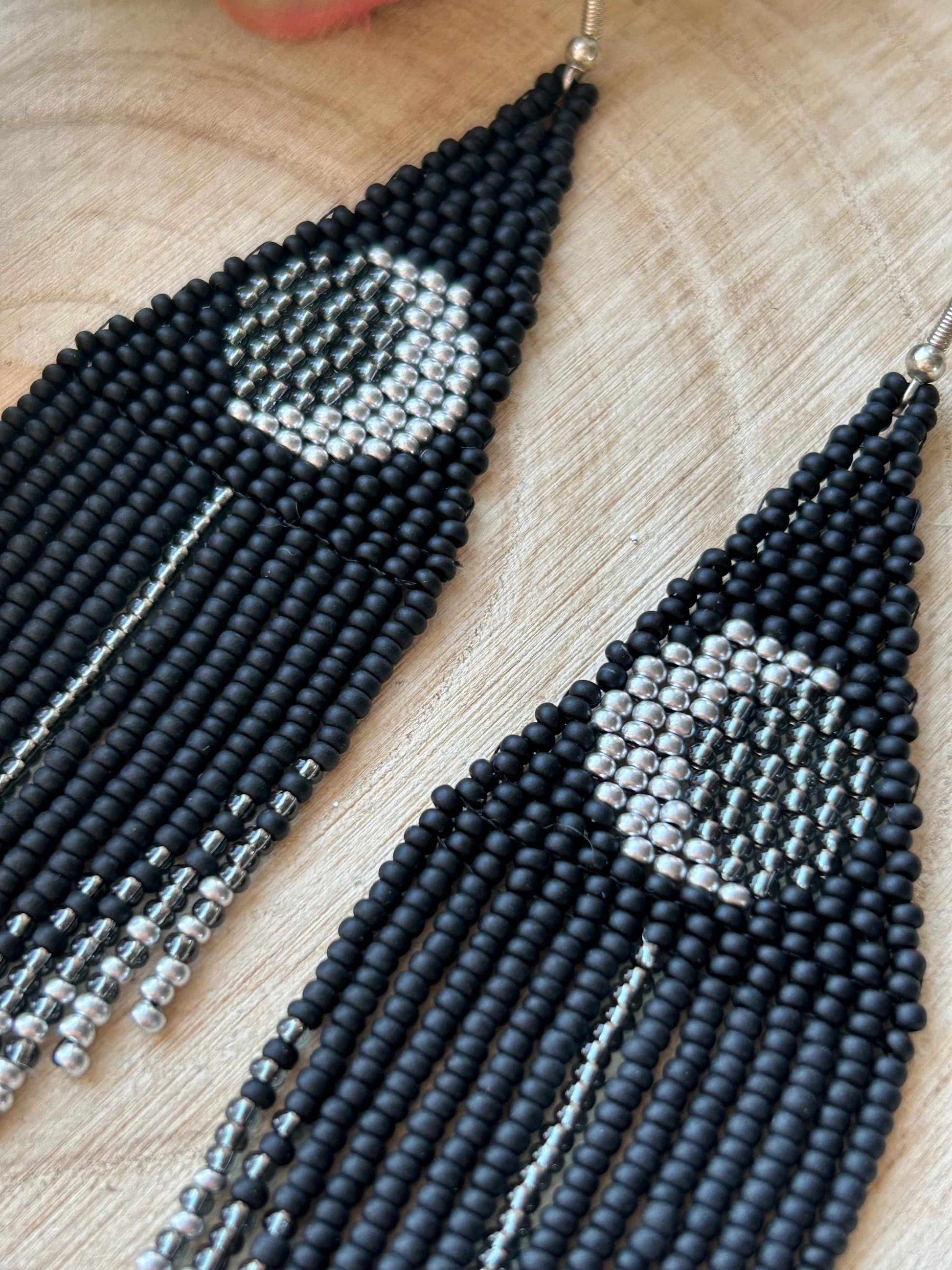 Unique handmade black beaded earrings with silver lunar eclipse motif and fringe. Boho celestial statement jewelry for mystical and artistic style image 4