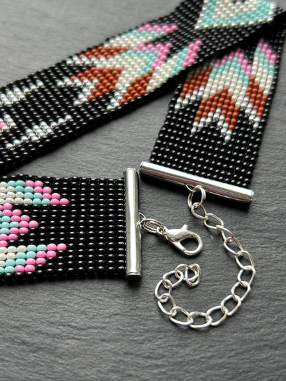 Unique handmade black beaded choker with geometric ornament in turquoise, pink, beige, and silver tones. Native American style boho statement choker necklace with adjustable chain image 6