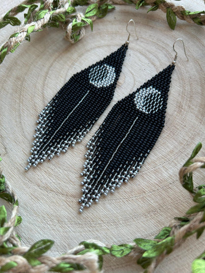 Unique handmade black beaded earrings with silver lunar eclipse motif and fringe. Boho celestial statement jewelry for mystical and artistic style image 10