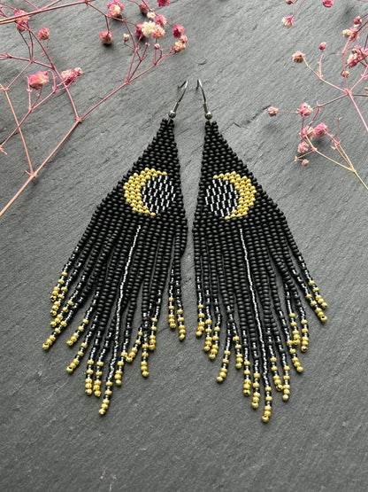 Handmade long black beaded earrings with golden lunar eclipse design and boho fringe. Unique statement jewelry image 6