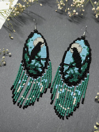 Long handmade beaded earrings in black, green, blue and beige featuring a raven and moon design with fringe. Boho statement jewelry, unique gift for her image 8