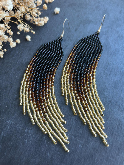 Handmade black beaded earrings with gold ombre and boho fringe. Unique statement jewelry with elegant shimmer, perfect gift for lovers of artisan style image 1