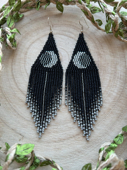 Unique handmade black beaded earrings with silver lunar eclipse motif and fringe. Boho celestial statement jewelry for mystical and artistic style image 9