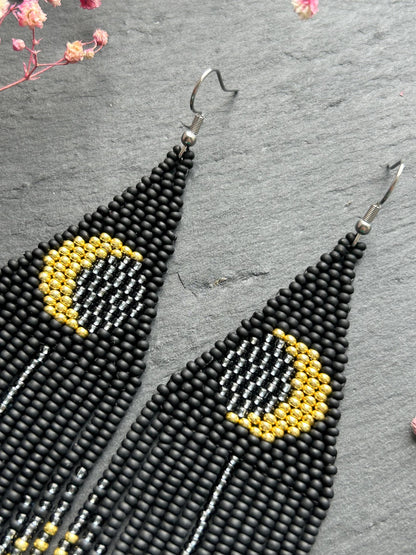 Handmade long black beaded earrings with golden lunar eclipse design and boho fringe. Unique statement jewelry image 3