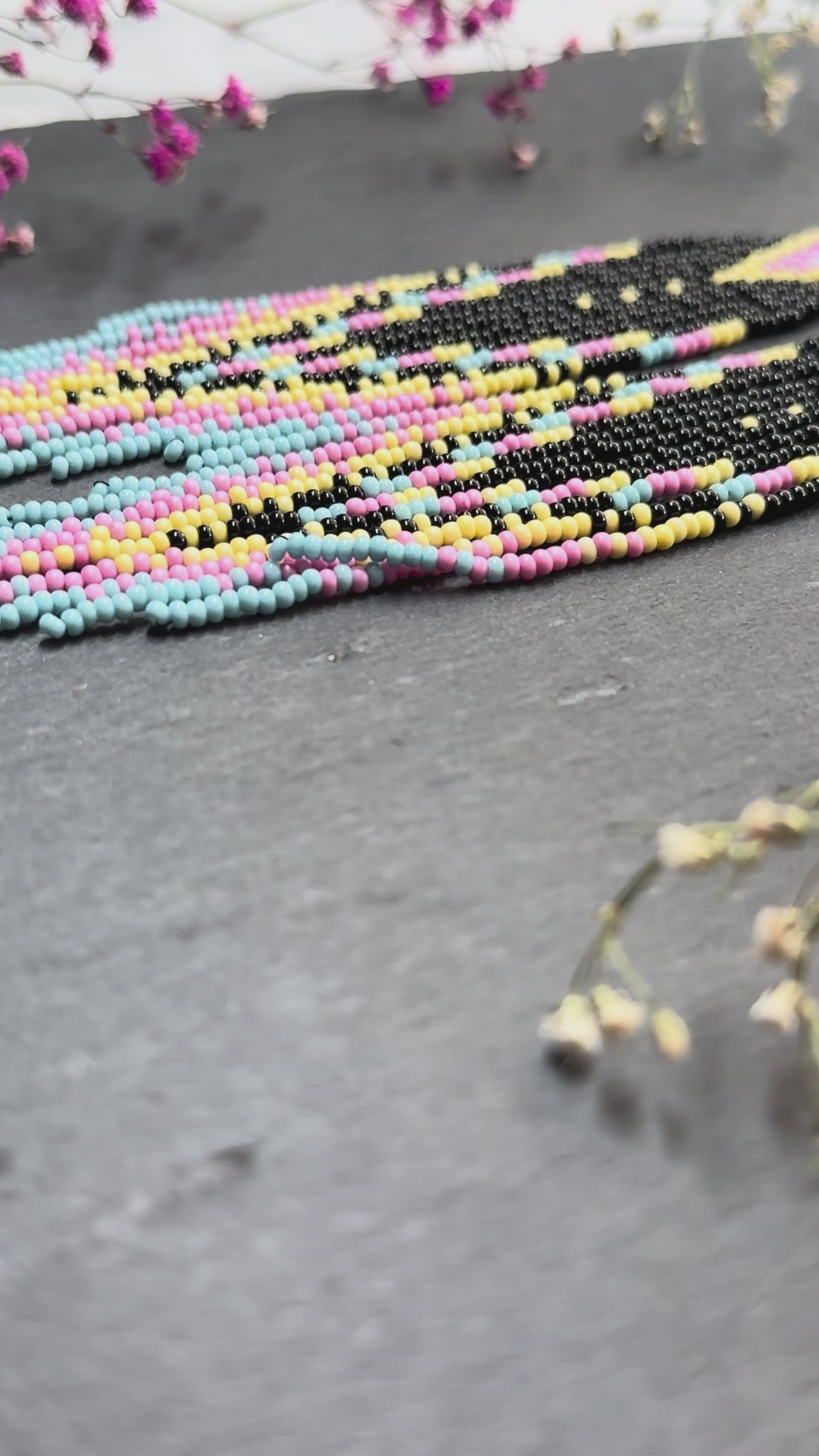 Unique handmade beaded earrings in black, blue, yellow and pink with geometric design. Boho style statement jewelry, cute multicolor earrings for women video 1