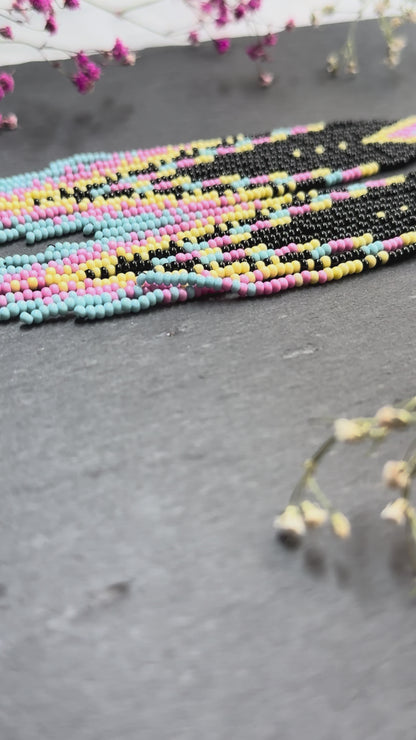Unique handmade beaded earrings in black, blue, yellow and pink with geometric design. Boho style statement jewelry, cute multicolor earrings for women video 1
