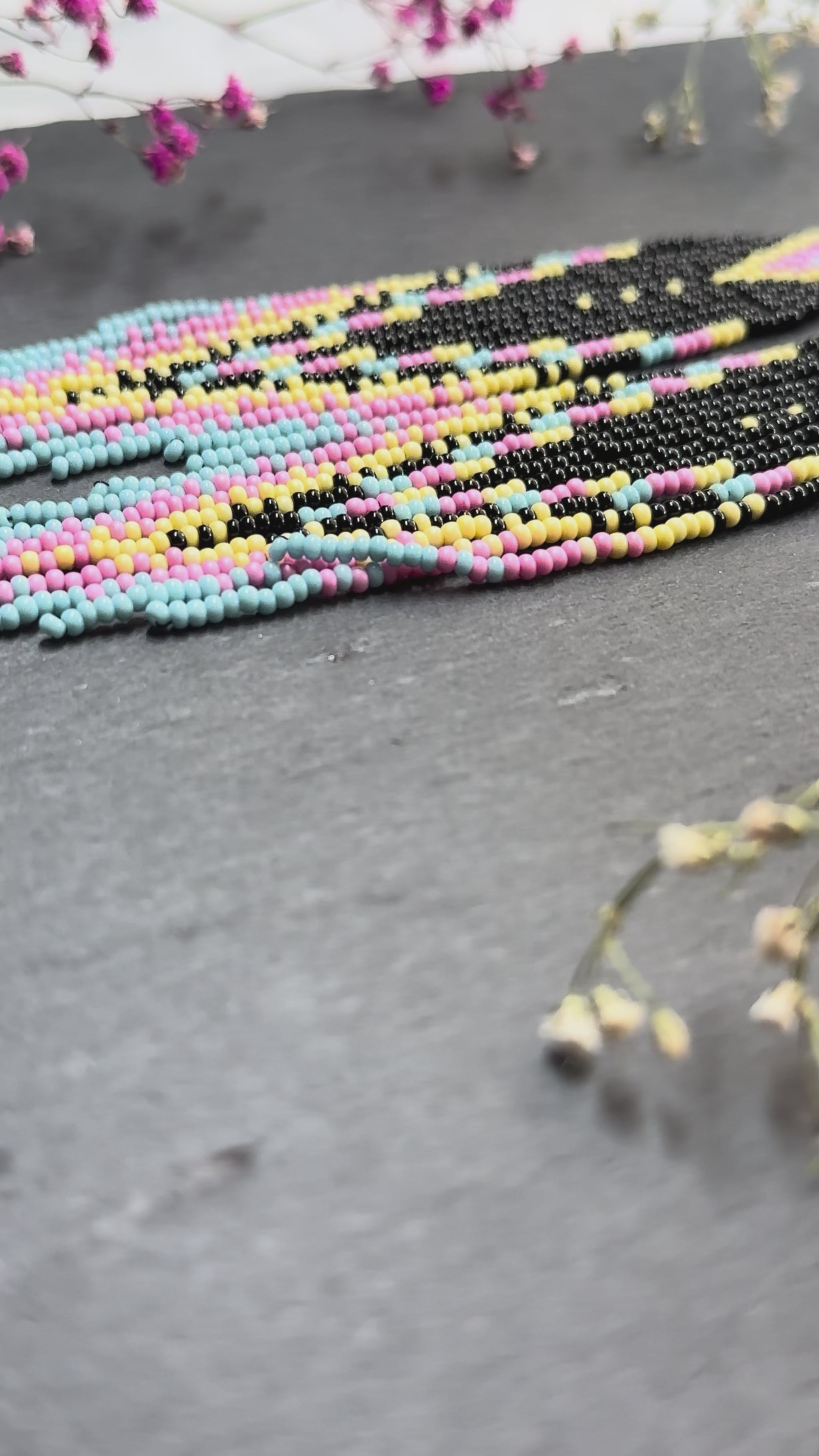 Unique handmade beaded earrings in black, blue, yellow and pink with geometric design. Boho style statement jewelry, cute multicolor earrings for women video 1