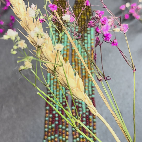 Long beaded earrings in turquoise, green, brown and burgundy with fringe. Unique handmade boho and Native statement earrings for women, perfect gift for her video 1