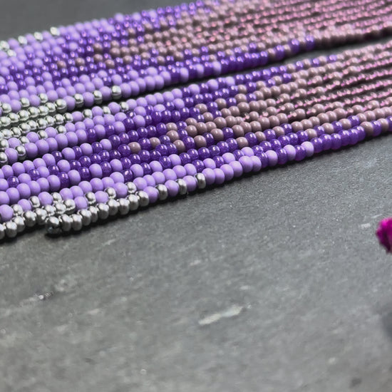Long purple and silver beaded fringe earrings on hoop base with 925 sterling silver hooks. Handmade statement earrings fringe and gradient design boho jewelry video 1