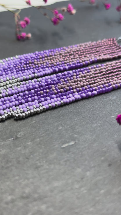 Long purple and silver beaded fringe earrings on hoop base with 925 sterling silver hooks. Handmade statement earrings fringe and gradient design boho jewelry video 1