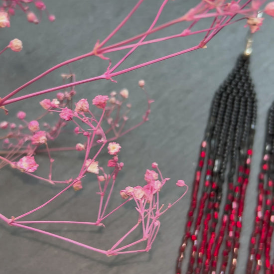 Long handmade black and red ombre beaded earrings with flowing fringe. Boho statement jewelry, unique artisanal accessory for bold everyday or evening style video 1