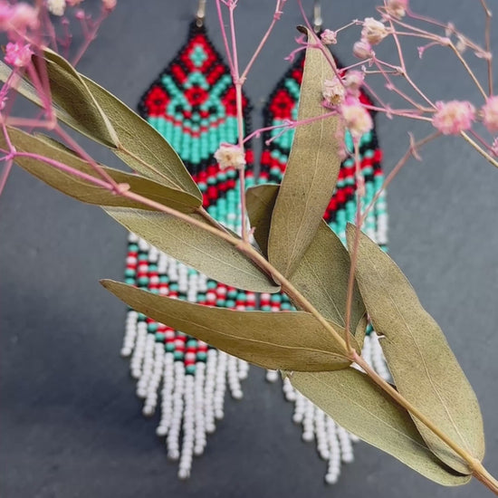 Handmade long beaded fringe earrings in red, black and turquoise with Native American motif. Boho statement dangle earrings for women, unique gift for her video 1