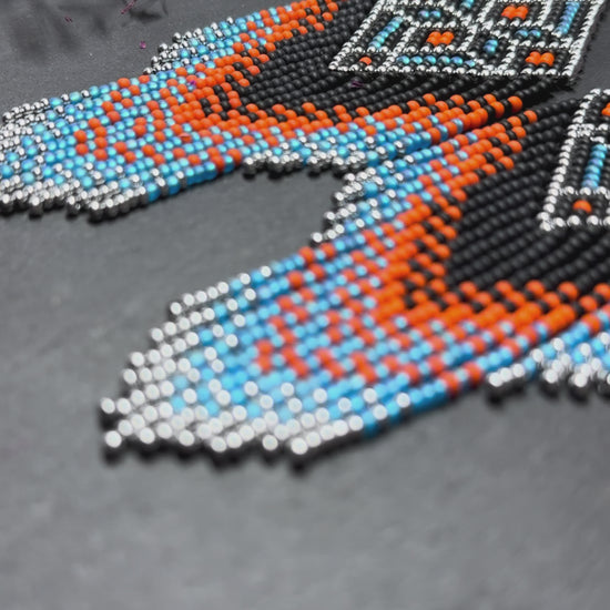 Black, blue, silver and orange beaded fringe earrings in boho and Native American style. Handmade statement earrings, unique colorful ethnic jewelry video 1