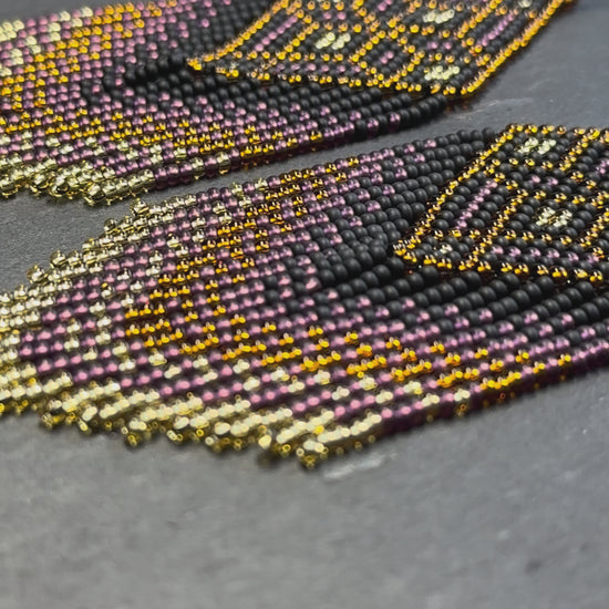 Handmade boho beaded statement earrings in black and copper gold with geometric design and long fringe. Ethnic style jewelry, unique perfect gift for her video 1