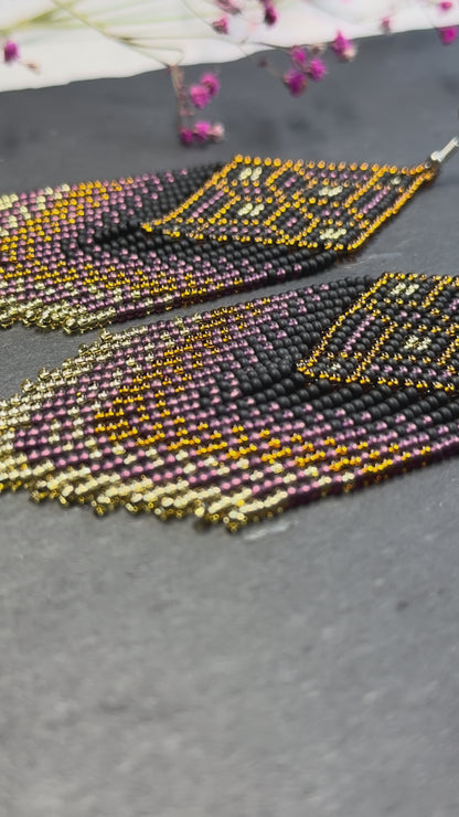 Handmade boho beaded statement earrings in black and copper gold with geometric design and long fringe. Ethnic style jewelry, unique perfect gift for her video 1