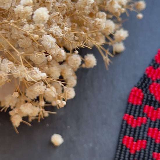 Handmade black beaded earrings with red heart fringe. Unique boho statement jewelry, perfect for Valentine’s Day, romantic gifts, and special occasions  video 1