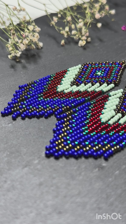 Handmade Blue, green and red beaded fringe earrings with geometric style. Unique bright boho statement jewelry with Native-inspired design and artisan beadwork video 1