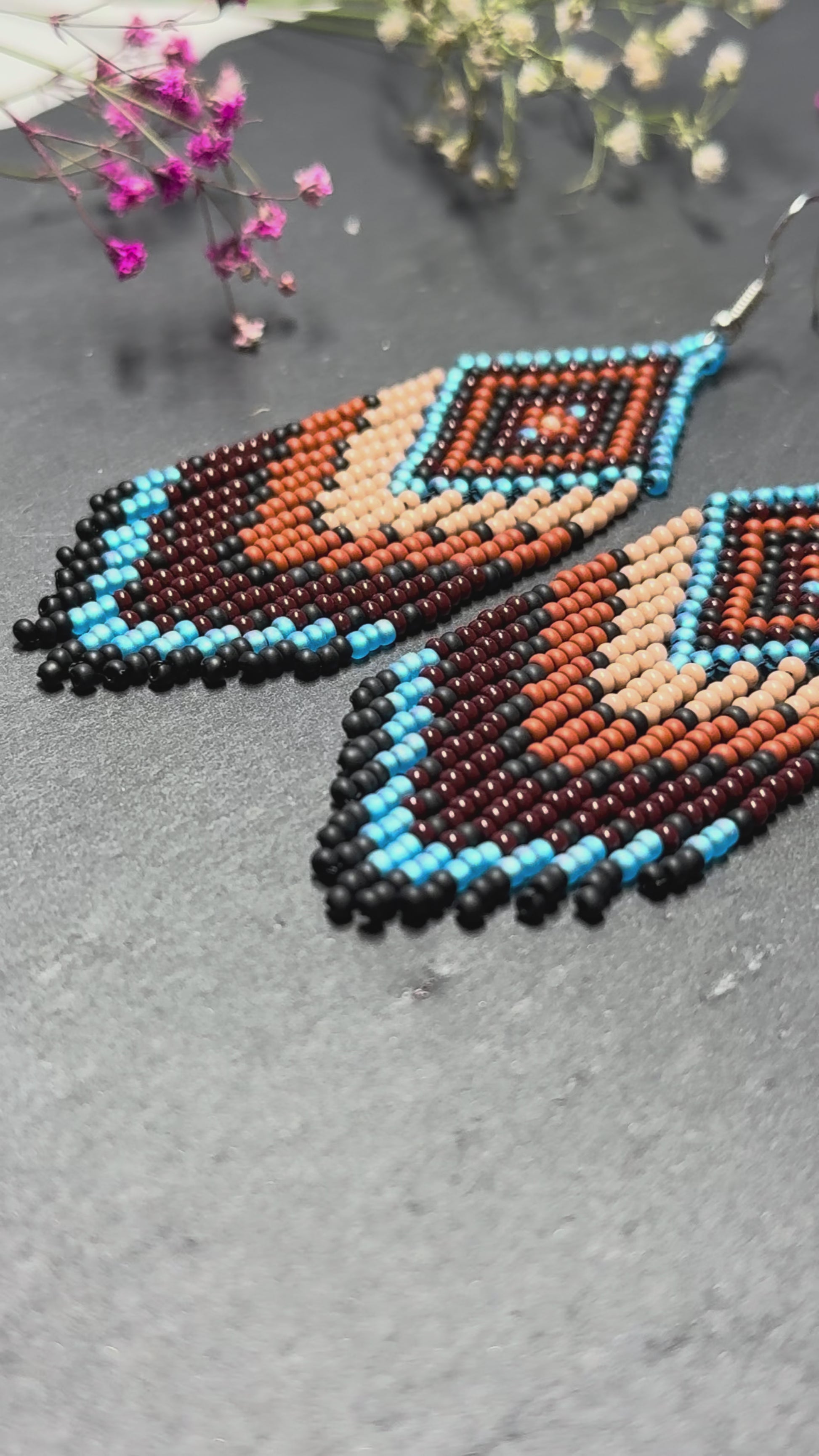 Handmade blue and brown beaded fringe earrings with geometric style. Unique bright boho statement jewelry with Native-inspired design and artisan beadwork video 1