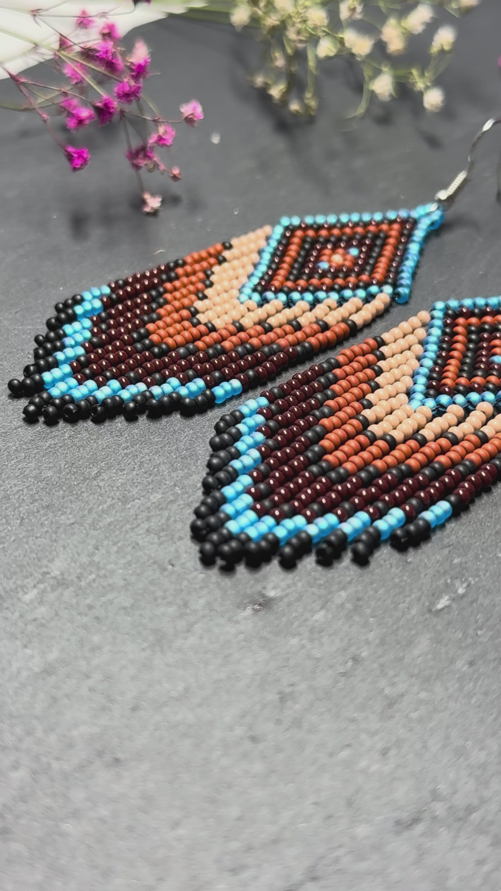 Handmade blue and brown beaded fringe earrings with geometric style. Unique bright boho statement jewelry with Native-inspired design and artisan beadwork video 1